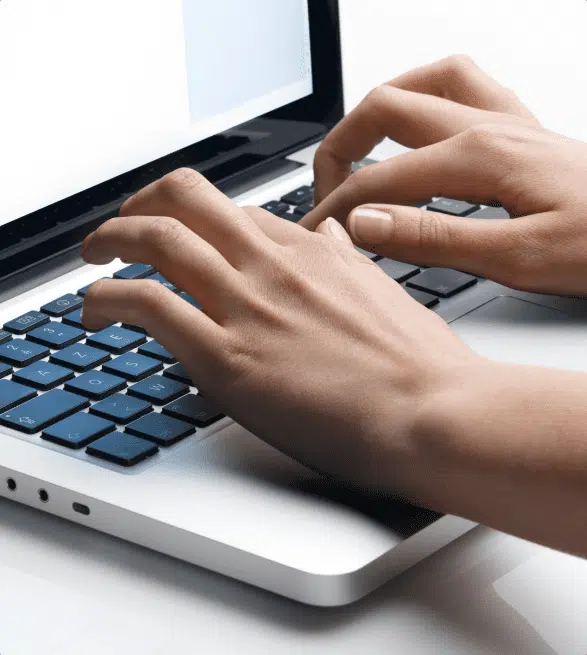 Image of hands typing on a keyboard to contact Unique Software Development Agency