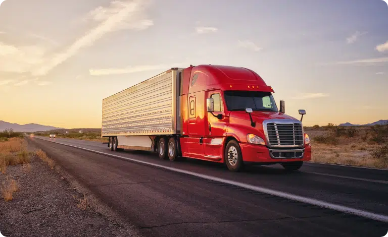 CargoBarn truck on highway - Unique Software Development's cutting-edge solution for Cargobarn transforms the logistics